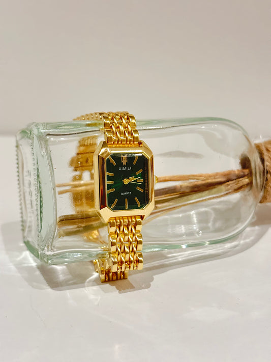 green dial gold watch