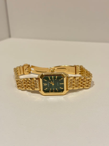 green dial gold watch